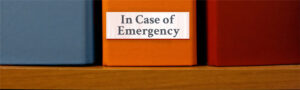 Binders with one reading 'In Case of Emergency'.