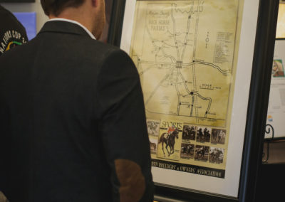 Man looking at information at the Hometown Derby Connections Exhibit