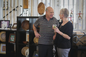 Man and woman chatting at the Hometown Derby Connections Exhibit Reception