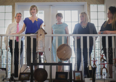 Group of people on a balcony at the Hometown Derby Connections Exhibit Reception