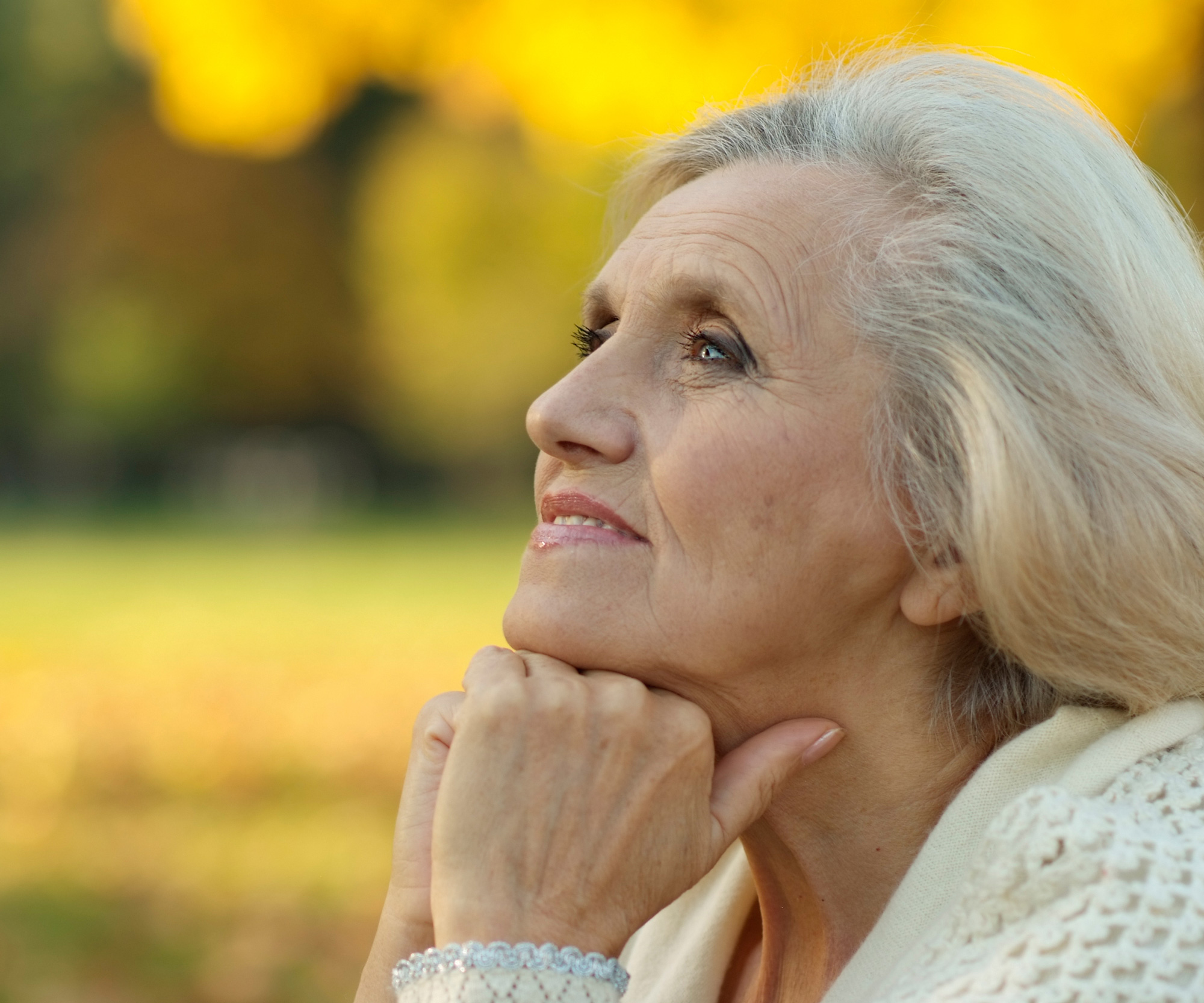 A retired woman thinking about whether she is ready to downsize