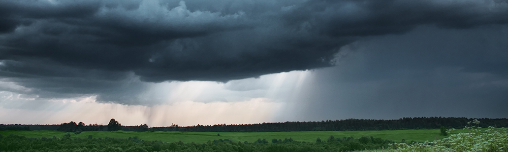 Storms in the distance with rain falling.