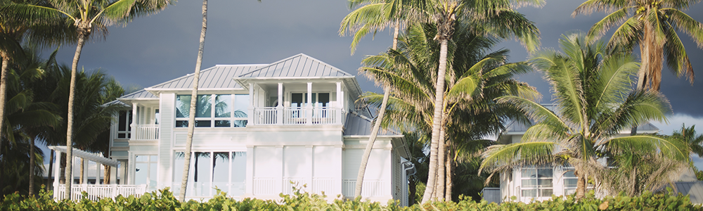 A beautiful home with storm clouds in the distance.