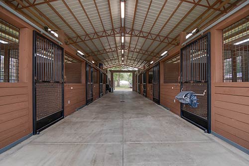 The interior of a horse barn.