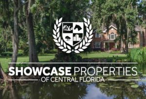 A large estate glimpsed through the trees with the Showcase Logo superimposed.