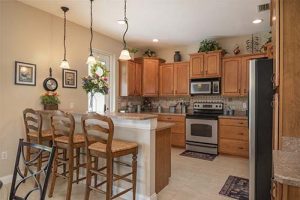 A cozy kitchen with counter dining area.