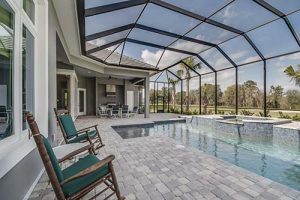 An expansive screen enclosed pool area.
