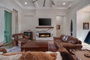 A beautiful gray and white fireplace.