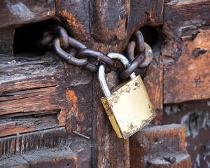 A lock and chain on a gate.