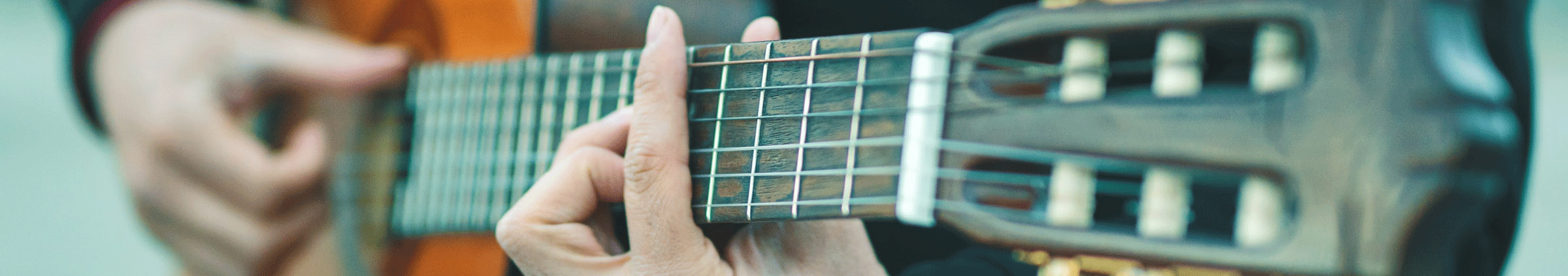 A man playing the guitar.