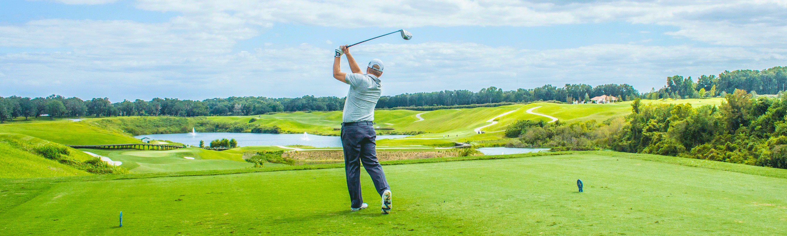 A man hitting a golf ball