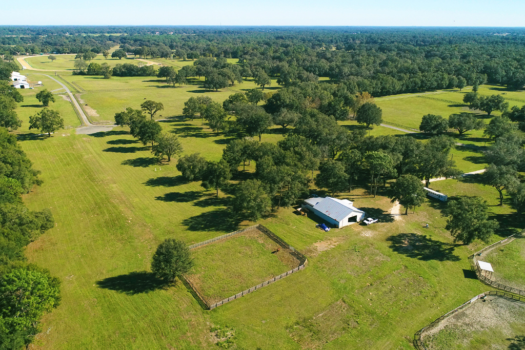 An aerial view of a large horse farm.