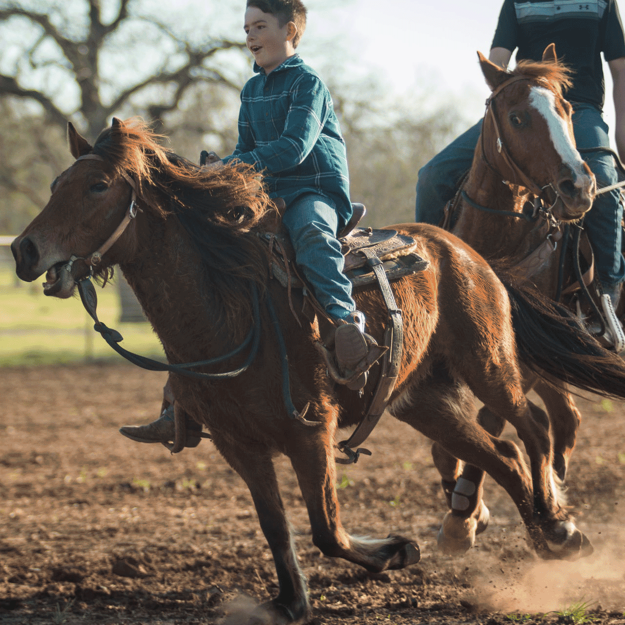 A boy on a western saddled horse