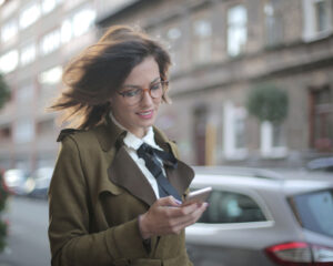 A woman checking a phone app.