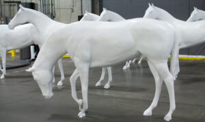 A group of unpainted Horse Fever horses.
