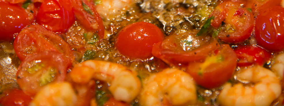 A cajun shrimp dish with tiny tomatoes