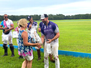 Valerie presenting an award to Chris.