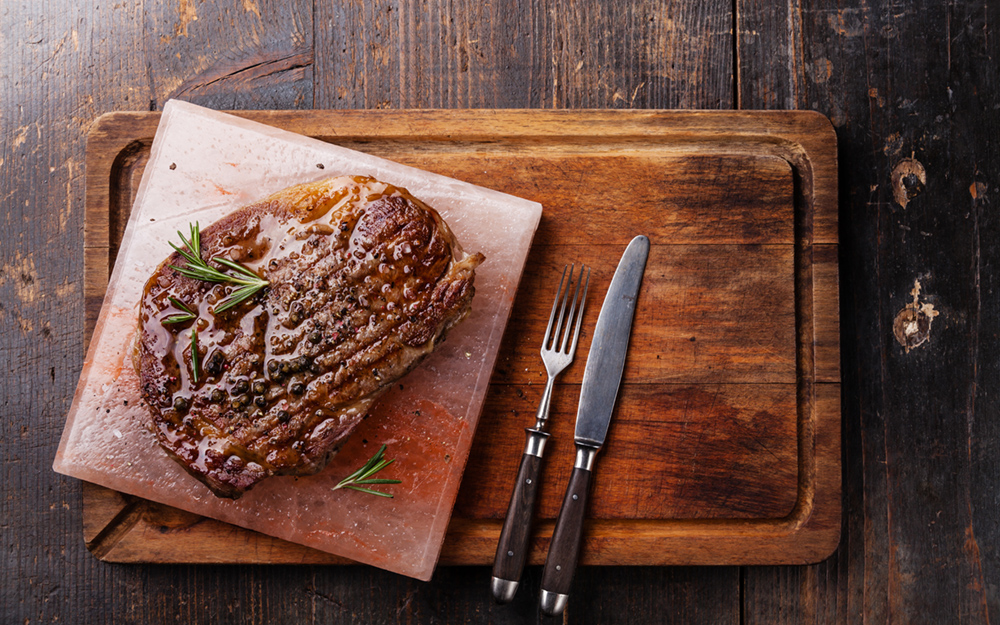 A steak on a Himalayan salt brick.