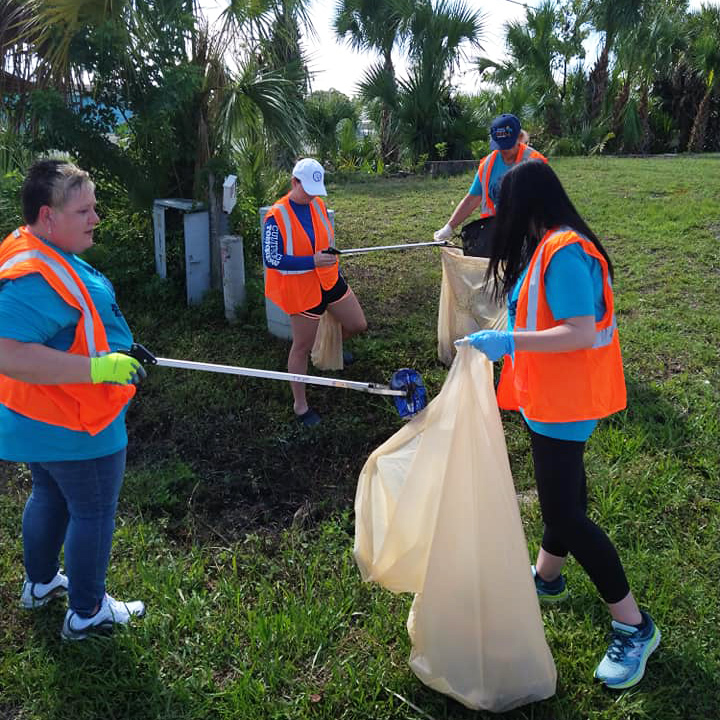 A group of volunteers picking up litter.