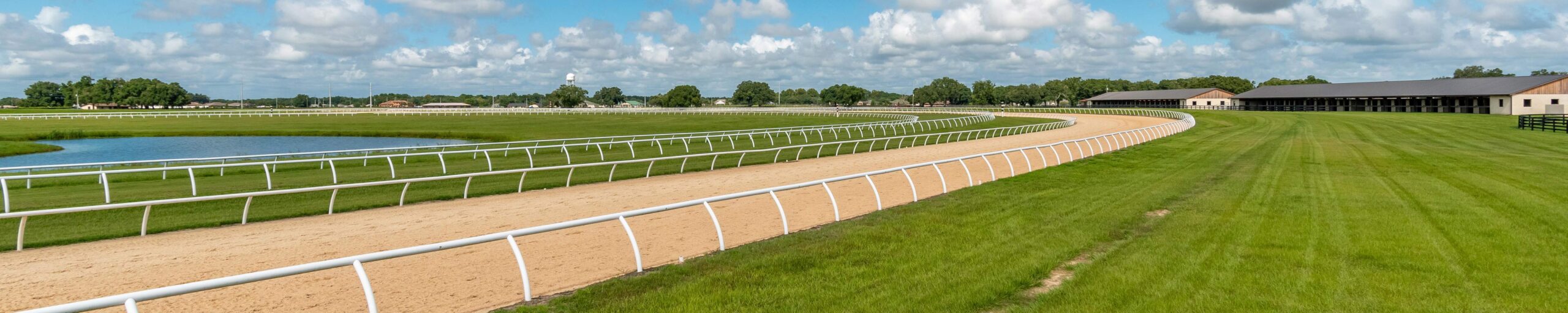 A horse and jockey on the track at Bridlewood Farm