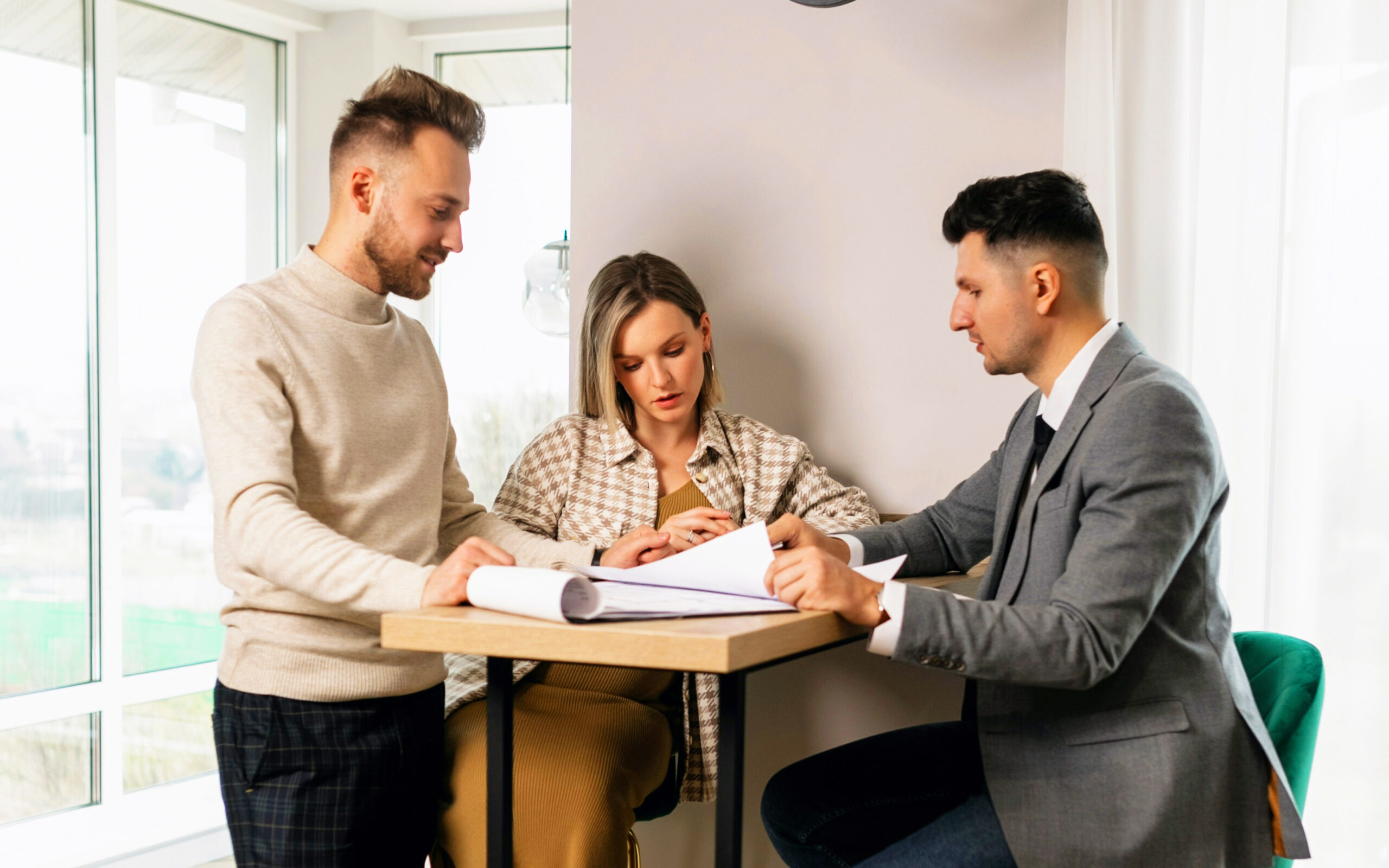 A couple discussing a real estate transaction.