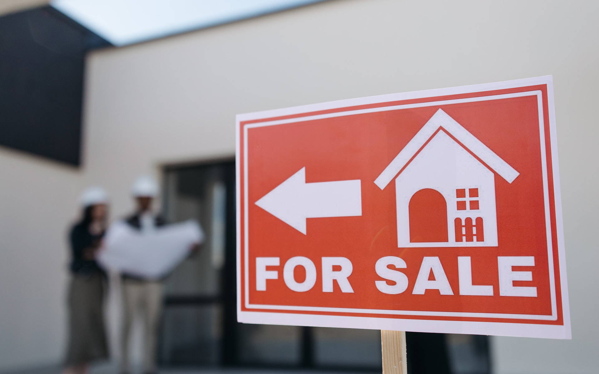 A sign reading "House for Sale"