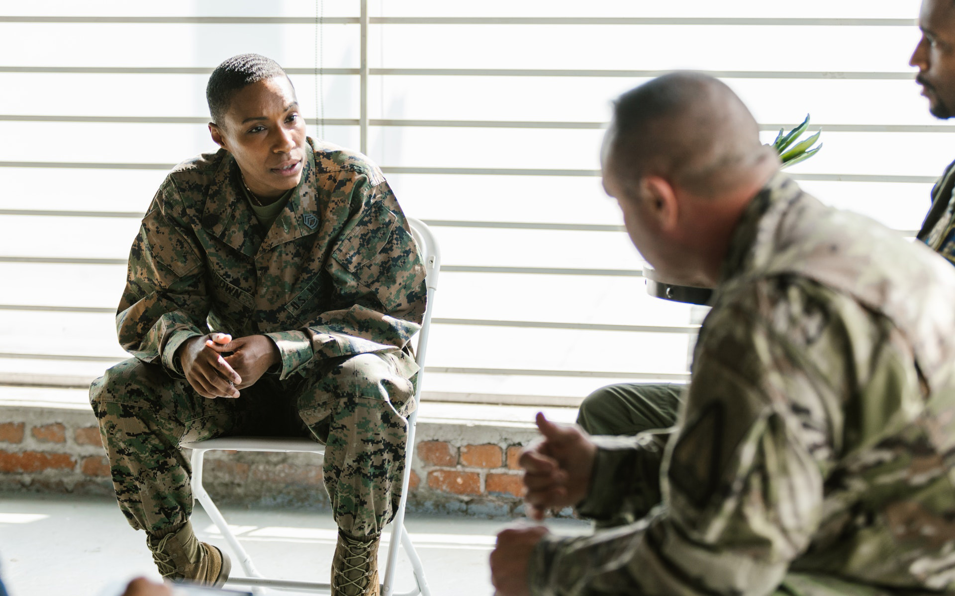 Military personnel having a discussion.