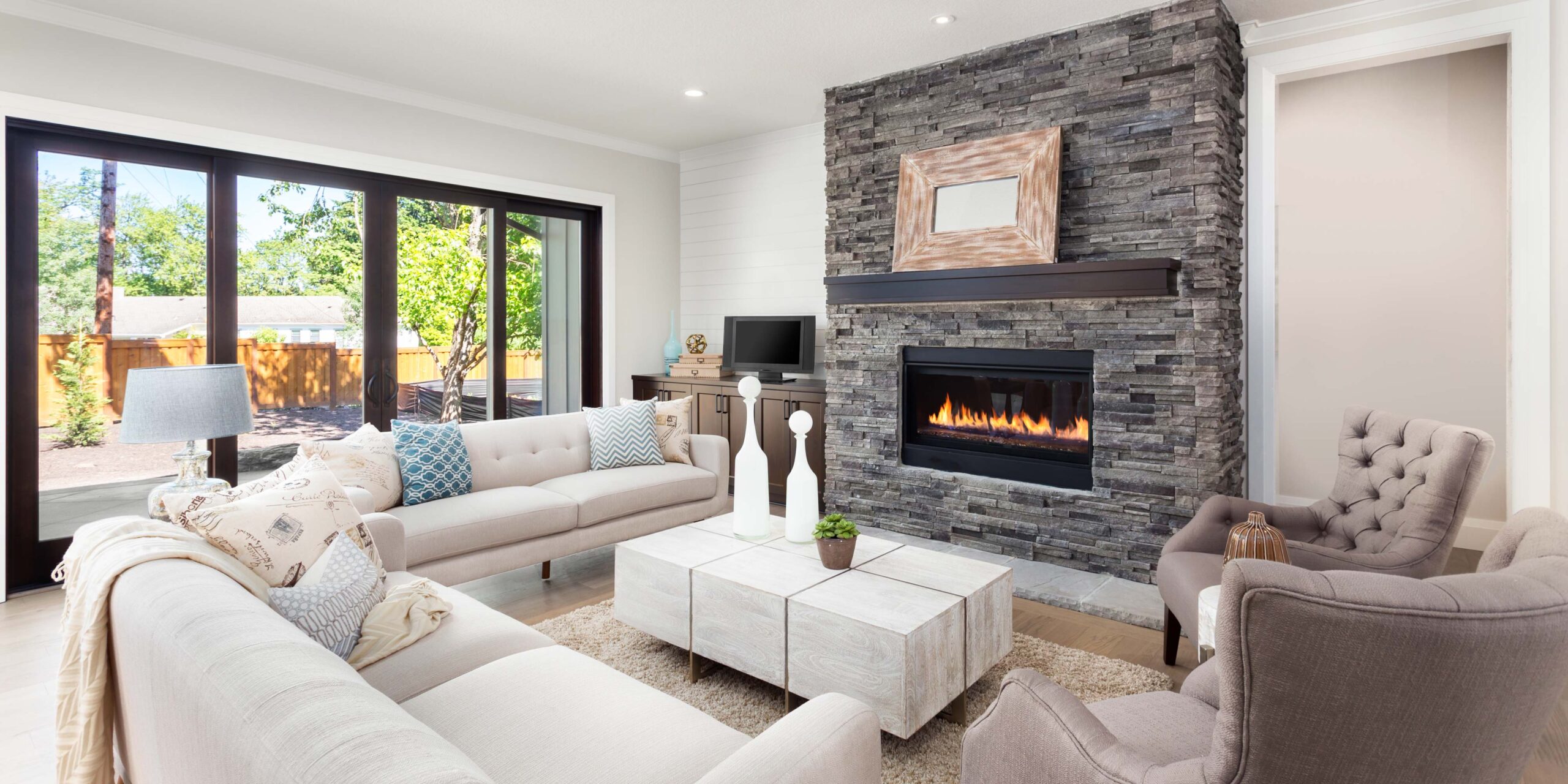 A beautiful floor to ceiling fireplace.