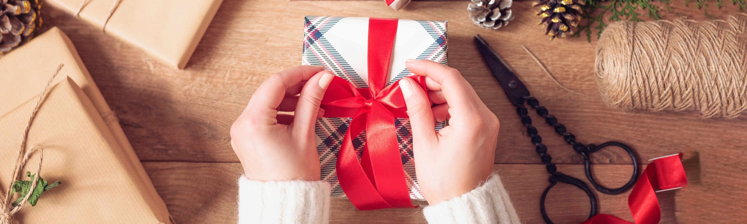 A woman wrapping up presents