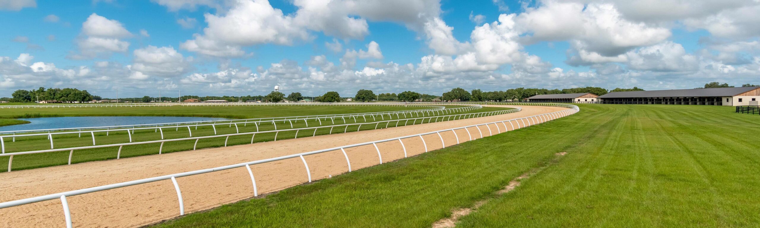 A horse and jockey on the track at Bridlewood Farm