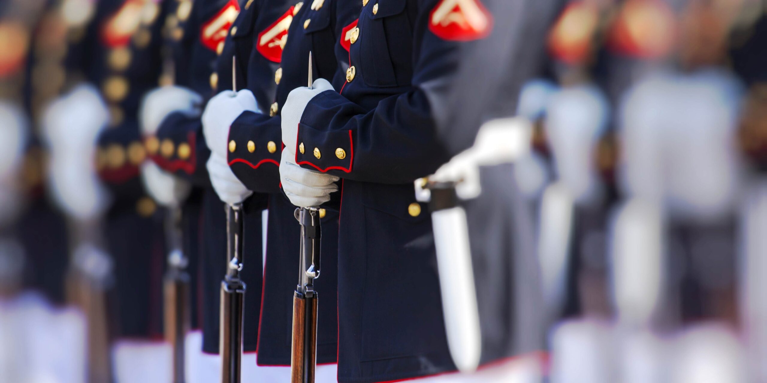 A line of Marines in dress uniforms.