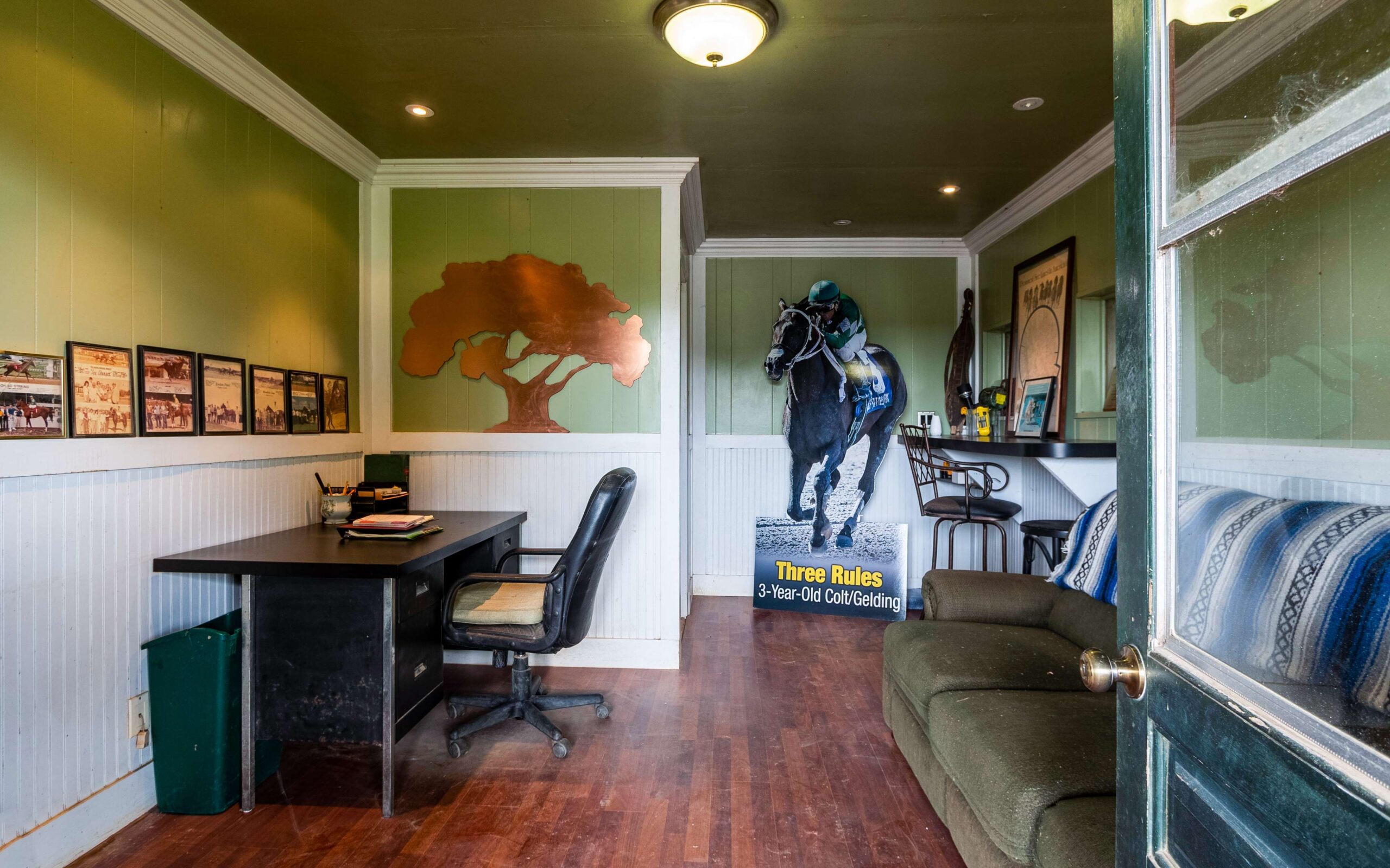 The farm's office with large racehorse image on the wall.