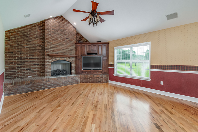 The floor-to-ceiling fireplace at 5028 W Anthony Road, Ocala, Florida 34475