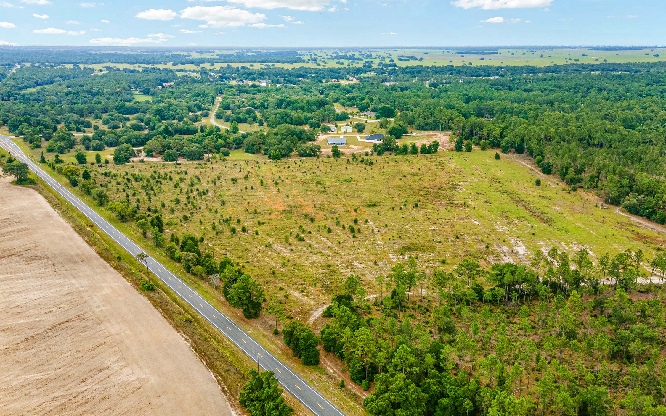 Another aerial view of the property showing road frontage.