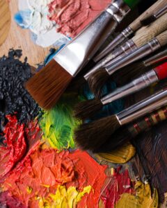 Paint brushes covered with paint