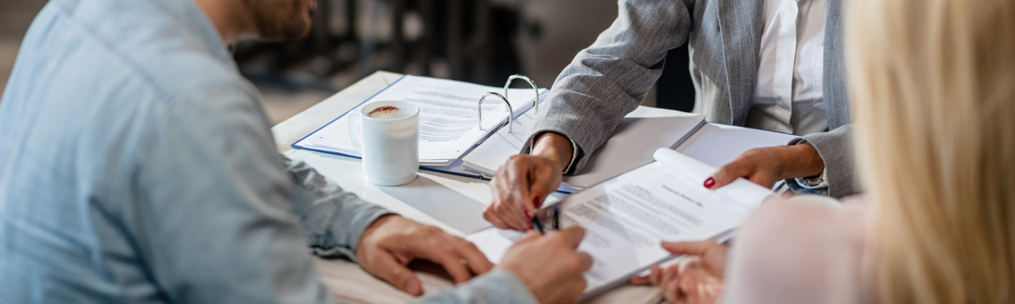 Showcase Properties Guide to Alachua County Schools Blog Image realtor showing contract to homebuyers