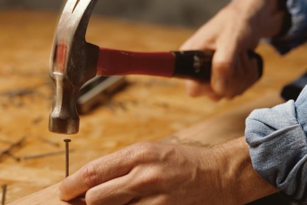 Carpenter using a hammer