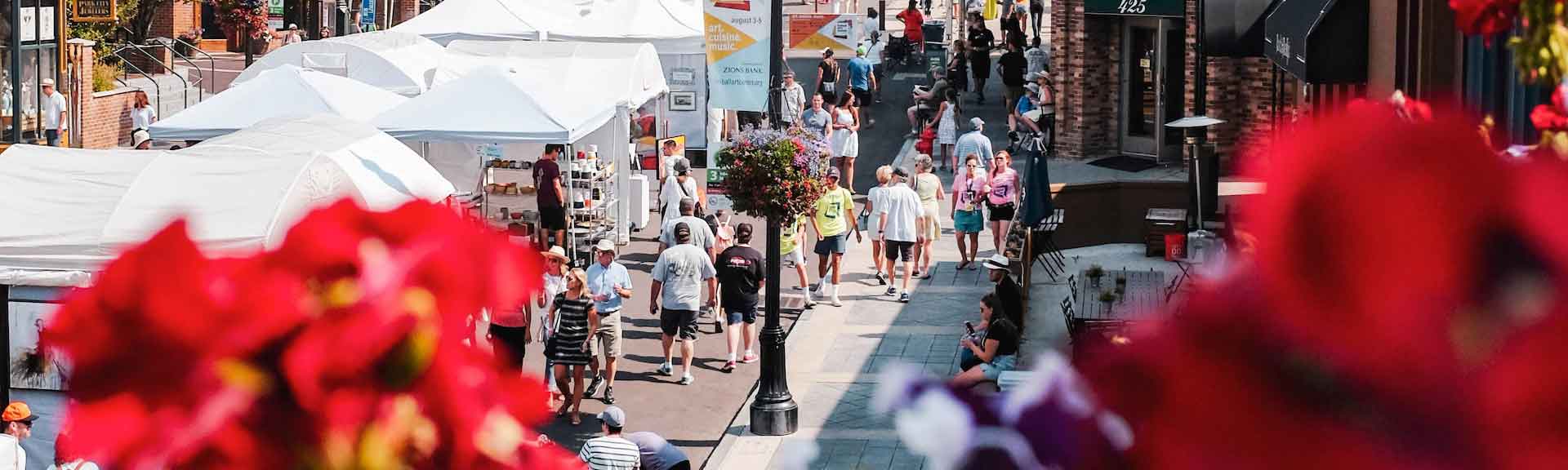 A view of a street with art vendors