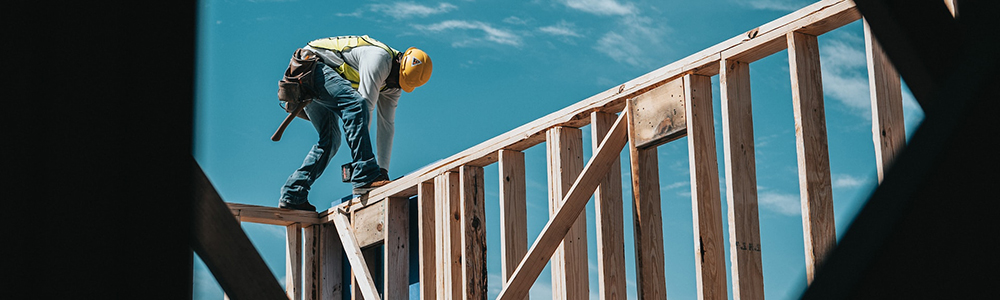 A builder working on a house.