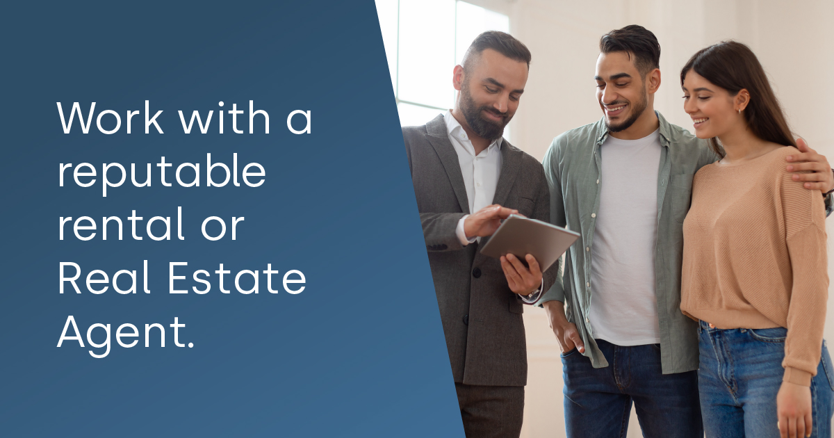 Work with a reputable rental or Real Estate Agent - couple looking at a home listing on a tablet with a realtor