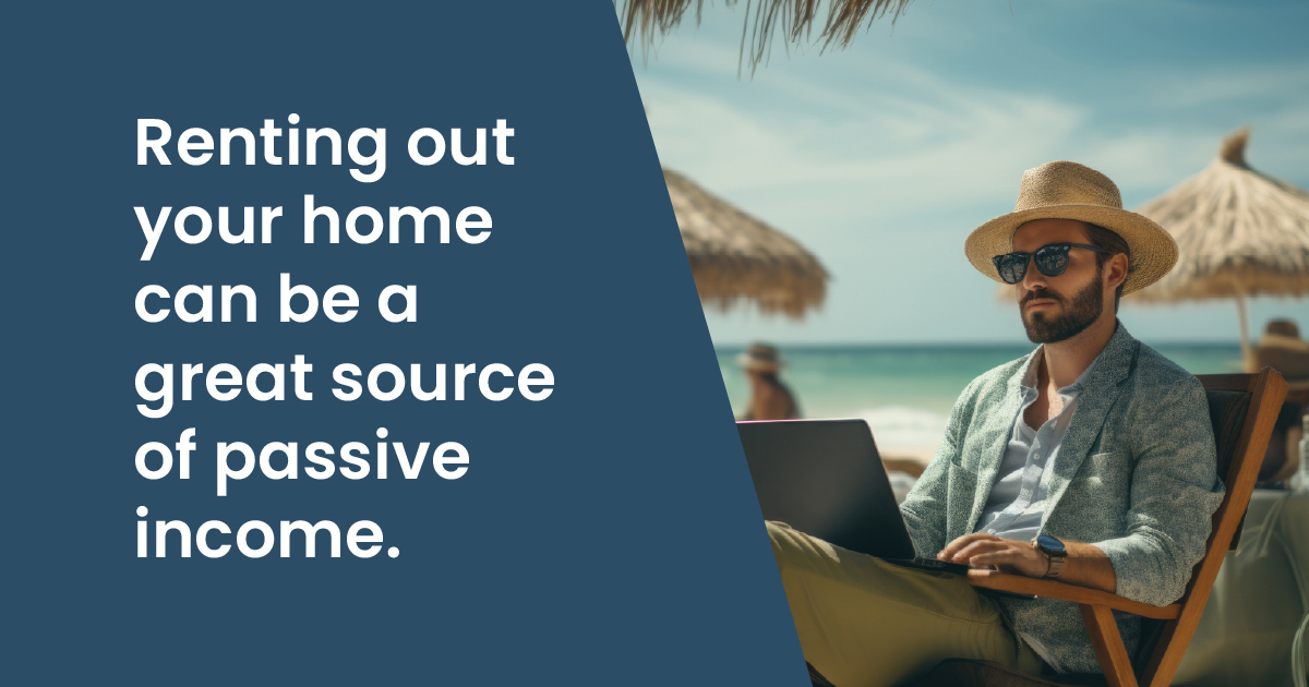 Renting your home can be a great source of passive income - Man on a beach looking at a laptop