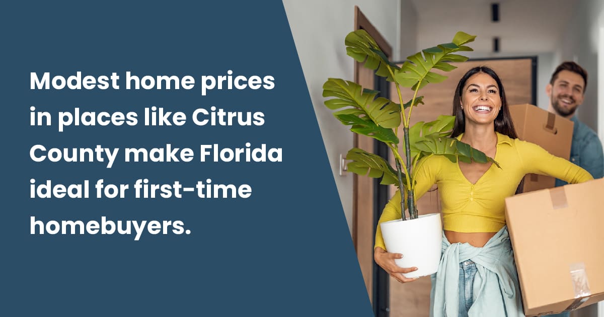 Modest home prices in places like Citrus County make Florida ideal for first-time homebuyers - Couple carrying boxes and a plant