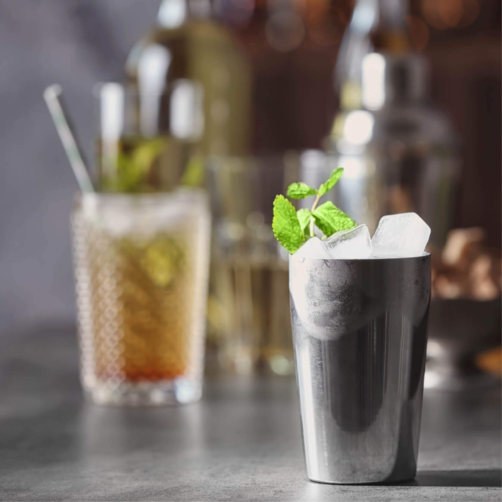 A deliciously cold mint julep in a silver cup.