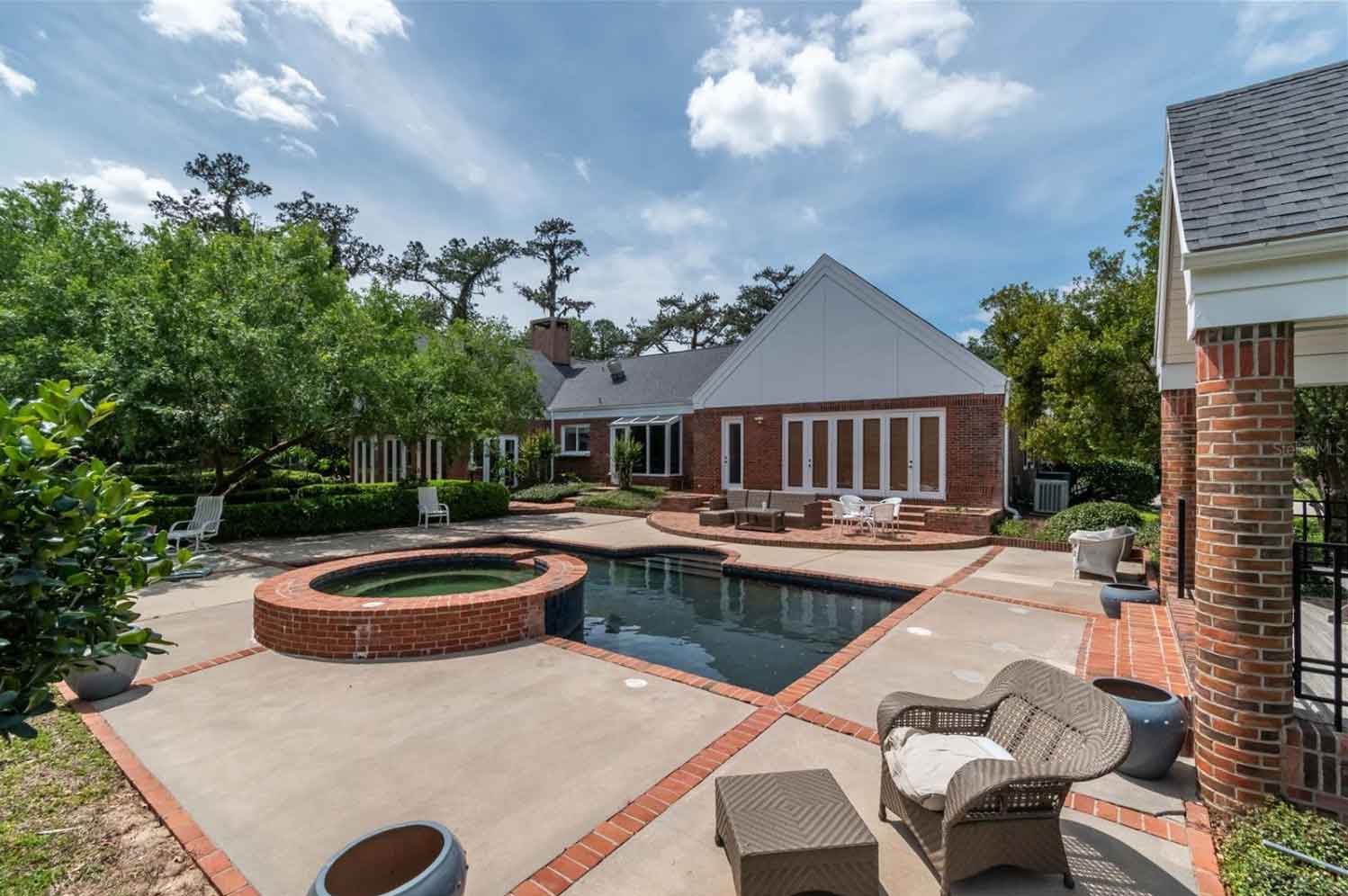 An indoor garden area with lots of windows and light.
