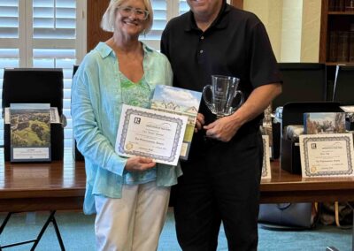 Valerie presenting Sonny Harnish with his award.