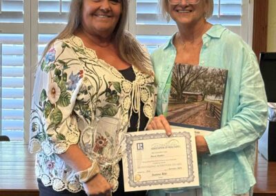 Valerie presenting Dawn Mahler with her award.