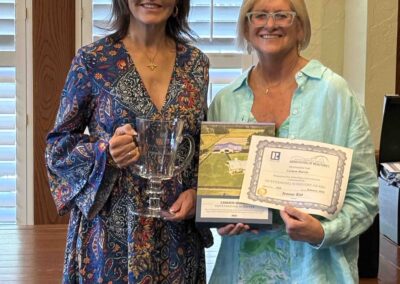 Valerie presenting Carmen Murvin with her award.