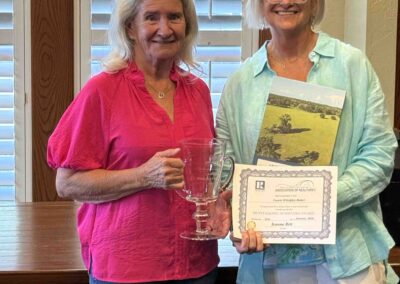 Valerie presenting Laurie Whelpley-Baker with her award.